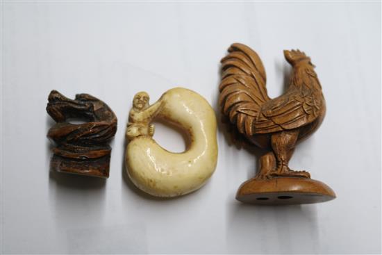 Four Japanese netsuke: one bronze, a cockerel, a dragon and figure on a gourd